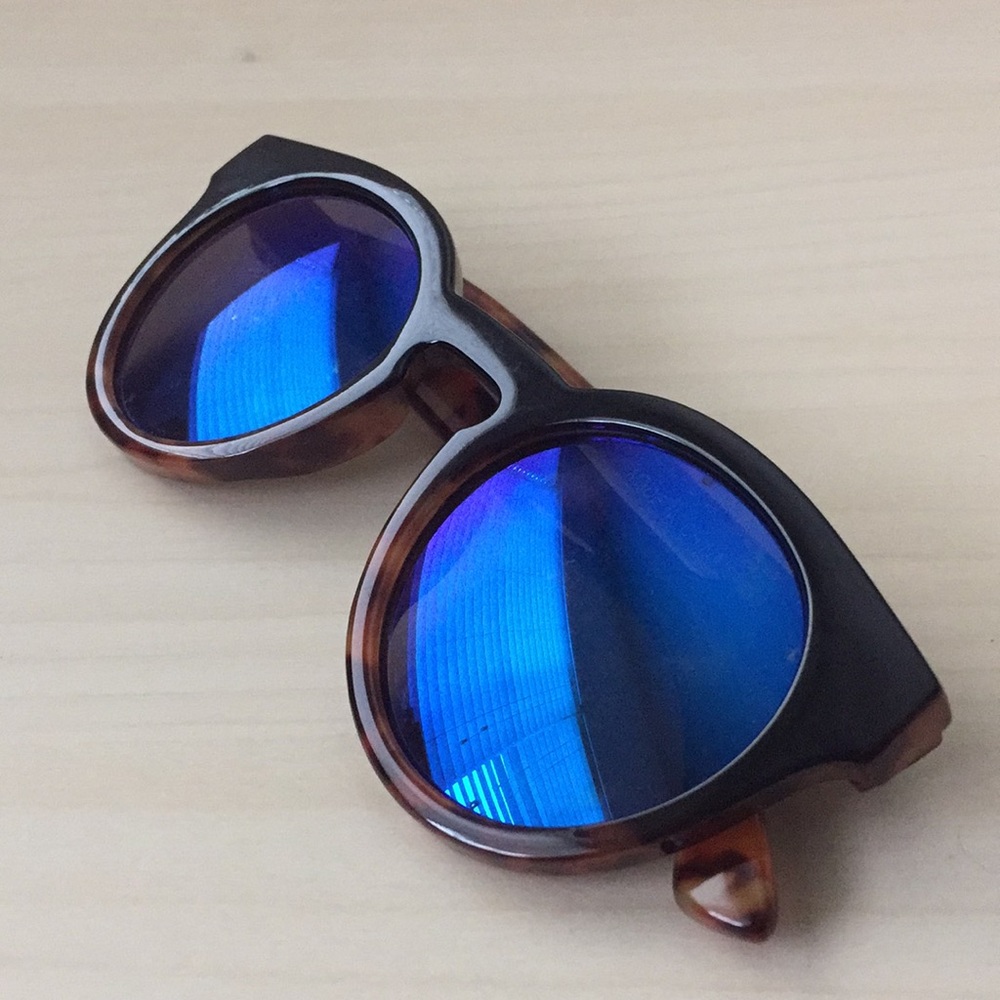 Metallic blue shades on tortoise framing